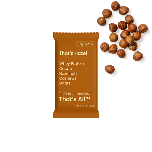 Thats Hazel - Whey protein package with cacao, hazelnuts, cashews, and dates on a white background