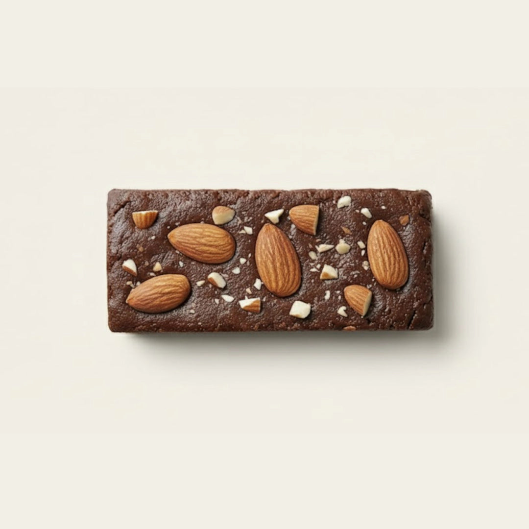 Coffee protein bar with nuts on a light beige background